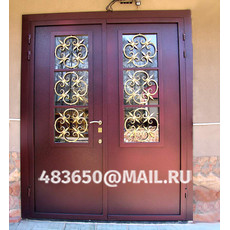На фото Входные металлические двери с ковкой, модель №21 на заказ в Орле